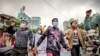 Protesters march through the streets during an anti-government demonstration in Mandalay, Myanmar, Dec. 7, 2021. (AP Photo, File) 