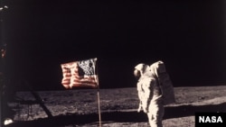 Astronaut Edwin E. "Buzz" Aldrin Jr. poses for a photograph beside the U.S. flag deployed on the moon during the Apollo 11 mission on July 20, 1969. (AP Photo/NASA/Neil A. Armstrong)