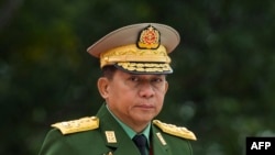 (FILES) Myanmar's Chief Senior General Min Aung Hlaing, commander-in-chief of the Myanmar armed forces, arrives for a ceremony to mark the 71th anniversary of Martyrs' Day in Yangon on July 19, 2018.