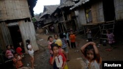 FILE - Ethnic Karen refugee children from Myanmar pass the time at the Mae La camp outside Mae Sot near the Thai-Myanmar border