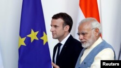 ့ပြင်သစ်သမ္မတ Emmanuel Macron ကိုအိန္ဒိယဝန်ကြီးချုပ် Narendra Modi ကြိုဆို။ မတ် ၁၀၊ ၂၀၁၈။