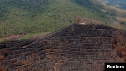 FILE - Burnt land is pictured after fires near Banjarmasin in South Kalimantan province, Indonesia, Sept. 29, 2019. 