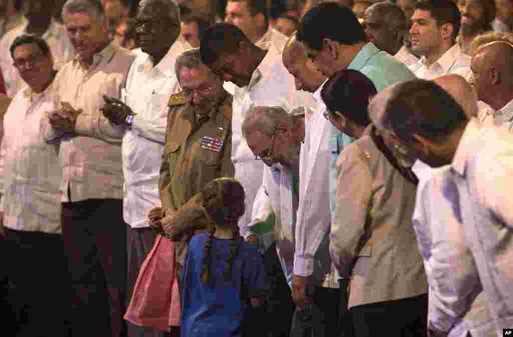 Cuban Leader Fidel Castro, center, talks with a girl during a gala for his 90th birthday at the 'Karl Marx' theater in Havana, Cuba, Saturday, Aug. 13, 2016. 