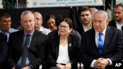 Blue and White party leader Benny Gantz, left, Esther Hayut, the Chief Justice of the Supreme Court of Israel, and Prime Minister Benjamin Netanyahu attend a memorial service for former President Shimon Peres in Jerusalem, Sept. 19, 2019.