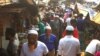 Rohingya refugees walk in market area inside a refugee camp in Ukhia on April 6, 2021 during the second day of weeklong government-imposed lockdown amid an increase of COVID-19 coronavirus cases. (Photo by Miraj KATEB / AFP)