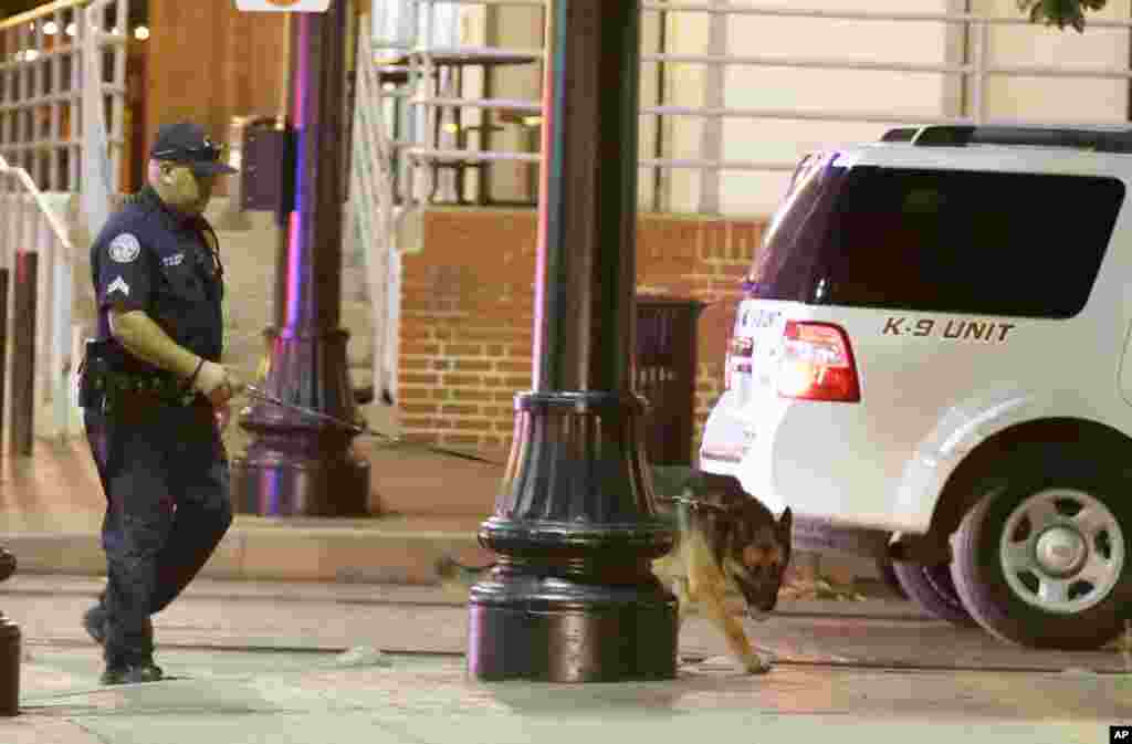 Law enforcement sweeps the area for explosives after a shooting in downtown Dallas on July 8, 2016. Snipers opened fire on police officers in the heart of Dallas on Thursday night, killing some of the officers. 