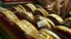 Picture taken on September 1, 2010 shows Myanmar vendors arranging a display of gold jewellery at a jewellery shop at Chinatown in downtown Yangon. Housewives huddle over jewellery counters in Yangon's bustling Chinatown -- but they do not have fashion o