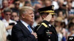 President Donald Trump attends a wreath laying ceremony at Arlington National Cemetery, May 29, 2017, in Arlington, Va. 