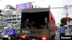 A vehicle transports soldiers amid the coronavirus disease (COVID-19) outbreak in Ho Chi Minh city, Vietnam August 20, 2021. REUTERS/Stringer NO RESALES NO ARCHIVES