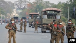 Myanmar soldiers stand guard 