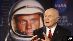 Sen. John Glenn talks, via satellite, with the astronauts on the International Space Station, before the start of a roundtable discussion titled "Learning from the Past to Innovate for the Future" Monday, Feb. 20, 2012, in Columbus, Ohio. Glenn was the fi