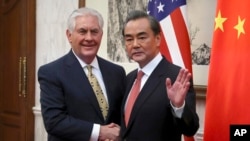 အမေရိကန်နိုင်ငံခြားရေးဝန်ကြီး Rex Tillerson နဲ့ တရုတ်နိုင်ငံခြားရေးဝန်ကြီ Wang Yi (March 18, 2017)