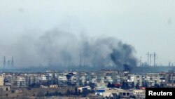 Smoke rises from strikes on the frontline city of Soledar