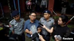 Detained Reuters journalist Wa Lone speaks to the media as he leaves Insein court in Yangon, Myanmar August 6, 2018. REUTERS/Ann Wang - RC1FE4368500