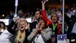 Delegates listen to speakers on the first night of the DNC (Photo: A. Shaker/VOA)