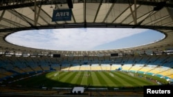 France's national soccer players warm up during a training session.