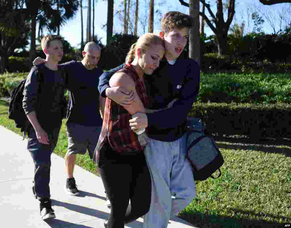 Students react following a shooting at Marjory Stoneman Douglas High School in Parkland, Florida, a city about 50 miles (80 kilometers) north of Miami, Feb. 14, 2018.