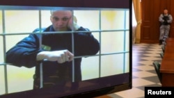 FILE PHOTO: Jailed Russian opposition leader Alexei Navalny is seen on a screen during a court hearing in Moscow