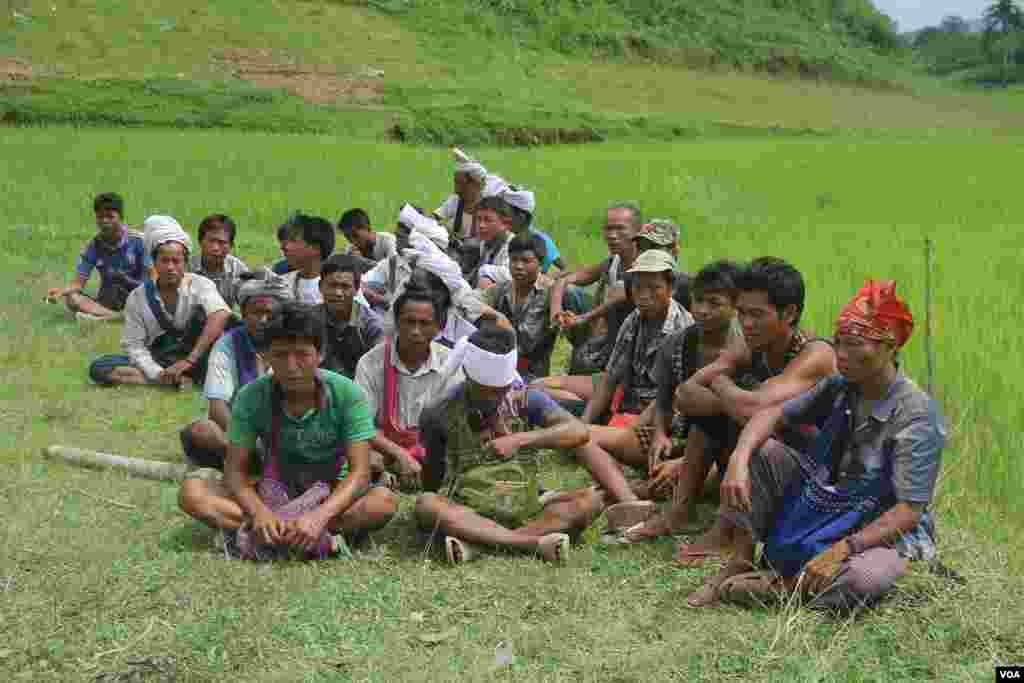 People gather near mass grave sites near Yebawkya village, Kamaungseik Township in Maungdaw District, Sept. 27, 2017. (Moe Zaw and Sithu Naing/VOA Burmese)