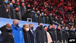 China's President Xi Jinping (5-L), party leaders, guests International Olympic Committee (IOC) President Thomas Bach attend the opening ceremony of the Beijing 2022 Winter Olympic Games at the National Stadium, known as the Bird's Nest, in Beijing, on February 4, 2022.