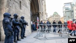 Policemen stand at the Stephansdom (St. Stephen's Cathedral) in Vienna, Austria, on December 24, 2023.