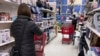 Shoppers shop at a retail store in Niles, Ill., Dec. 18, 2021. 