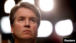 FILE - U.S. Supreme Court nominee Brett Kavanaugh listens during his Senate Judiciary Committee confirmation hearing on Capitol Hill in Washington, U.S., Sept. 4, 2018. 