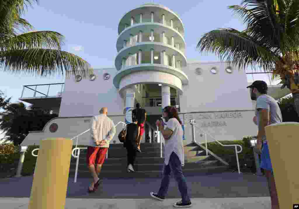 People line up to vote on Election Day, Nov. 8, 2016, at the Pelican Harbor Marina, in Miami.