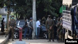 Soldiers search the National League for Democracy (NLD) headquarters after the coup in Yangon, Myanmar, February 15, 2021. REUTERS/Stringer