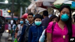 People in Yangon seen here wearing masks to protect from swine flu virus. Jul. 27th, 2017.