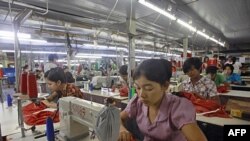 Myanmar laborers work in a garment factory on the outskirts of Yangon.