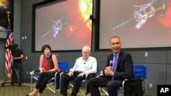 Astrophysicist Eugene Parker sits between Johns Hopkins University project scientist Nicola Fox, left, and NASA’s science mission chief Thomas Zurbuchen, during a news conference about the Parker Solar Probe at the Kennedy Space Center in Florida, Aug. 9,