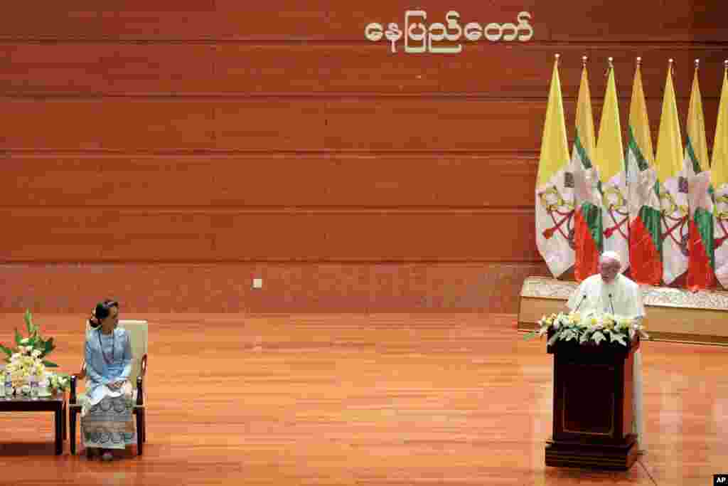 Myanmar&#39;s leader Aung San Suu Kyi, left, listens as Pope Francis delivers his speech at the International Convention Center of Naypyitaw, Nov. 28, 2017.