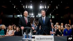 President Donald Trump's Supreme Court nominee, Brett Kavanaugh, a federal appeals court judge, right, accompanied by Senate Judiciary Chairman Chuck Grassley, R-Iowa, left, on Capitol Hill