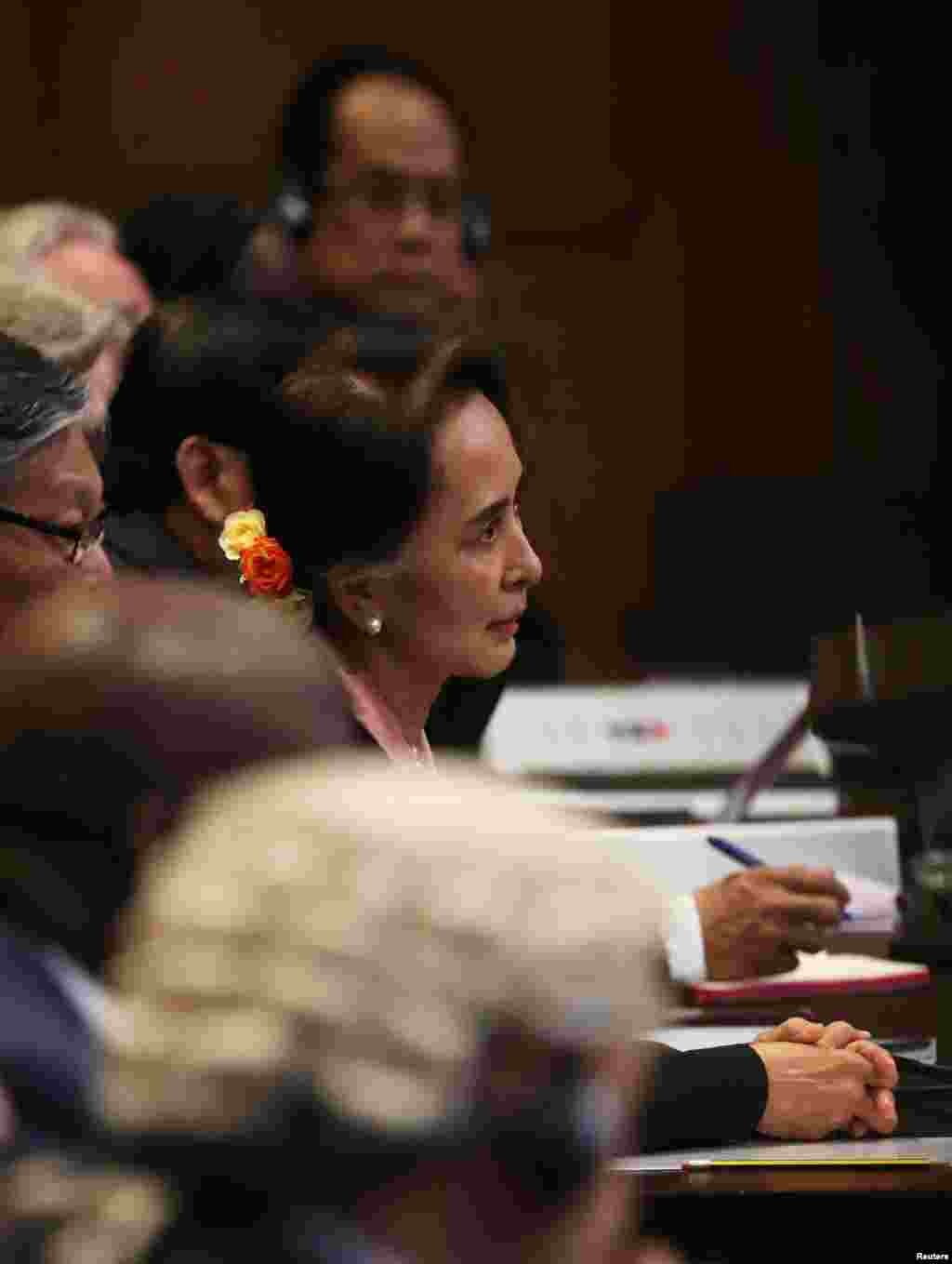 Myanmar&#39;s leader Aung San Suu Kyi attends a hearing in a case filed by Gambia against Myanmar alleging genocide against the minority Muslim Rohingya population, at the International Court of Justice (ICJ) in The Hague, Netherlands December 10, 2019. REUT