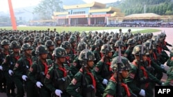 United Wa State Army (UWSA) soldiers participate in a military parade, to commemorate 30 years of a ceasefire signed with the Myanmar military in the Wa State, in Panghsang on April 17, 2019. (Photo by Ye Aung THU / AFP)