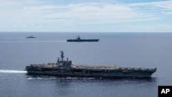 USS Ronald Reagan နှင့် USS Nimitz လေယာဉ်တင်သင်္ဘောကြီး တို့ စစ်ရေလေ့ကျင့်နေစဉ် (မှတ်တမ်းဓါတ်ပုံ-၂၀၂၀ ဇူလိုင်လ ၇ ရက်နေ့) 