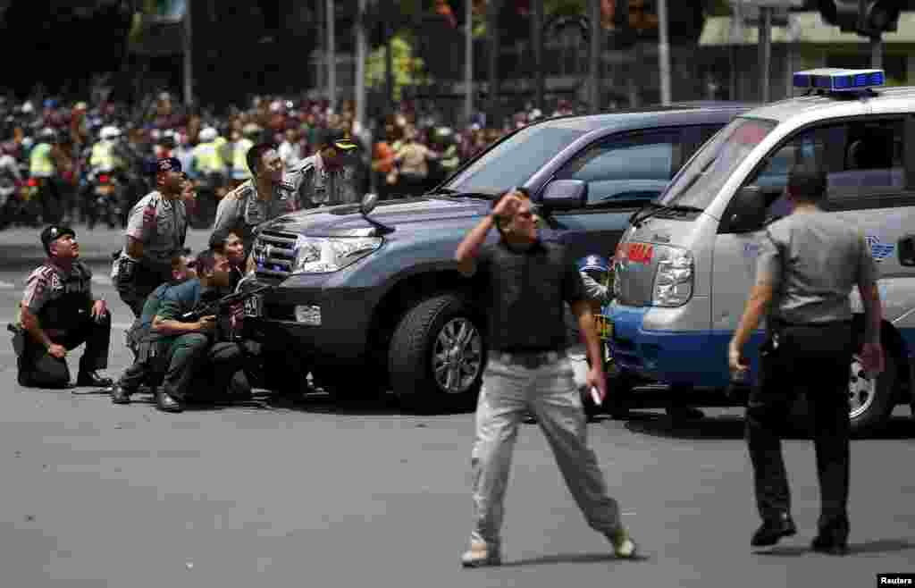 Several explosions went off and gunfire broke out in the center of the Indonesian capital and police said they suspected a suicide bomber was responsible for at least one the blasts.