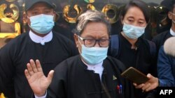 Khin Maung Zaw (C), a lawyer representing detained Myanmar civilian leader Aung San Suu Kyi and ousted president Win Myint, is pictured outside Zabuthiri Township Court in Naypyidaw on February 16, 2021. (Photo by STR / AFP)