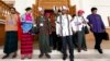 Clad in ethnic Chin and Myanmar traditional attire, newly-elected members of parliament from Myanmar opposition leader Aung San Suu Kyi's National League for Democracy party gather as they visit Lower House of parliament Wednesday, Jan. 27, 2016, in Naypyitaw, Myanmar. The second